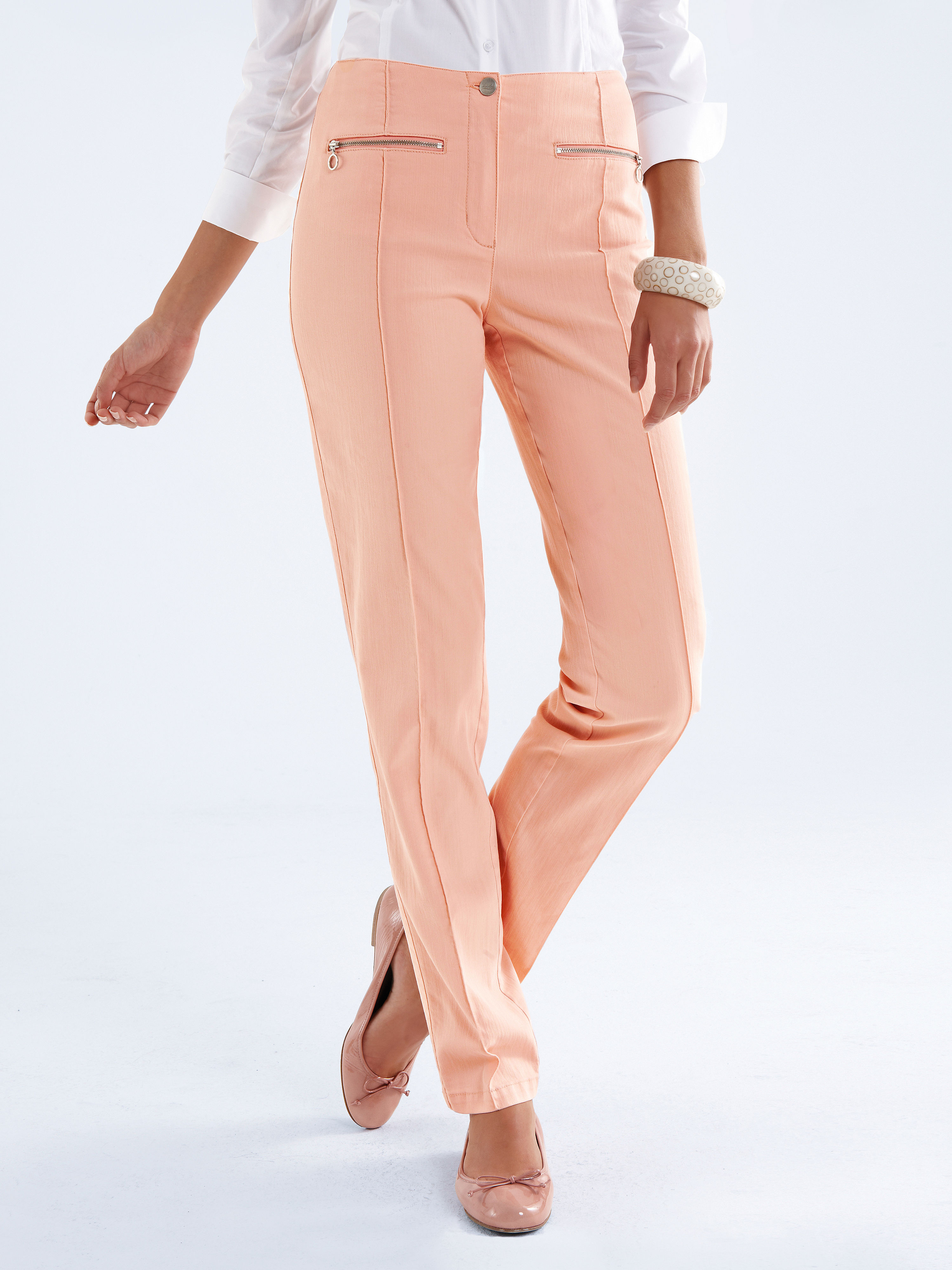 Image of Figure-flattering trousers with narrow legs Vanilia orange